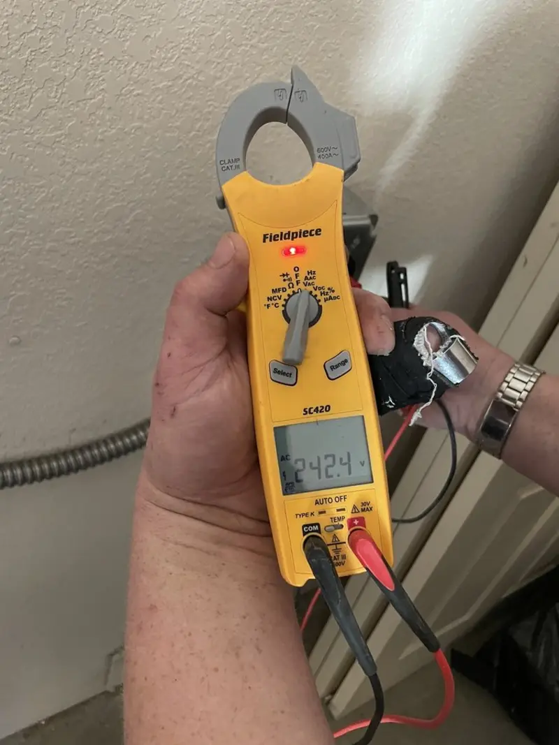 Voltage testing with clamp meter during Ceiling Fan Installation in Steilacoom